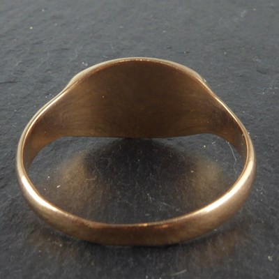 Lot 1106 - A 9ct rose gold signet ring with rubbed...