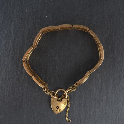 Lot 1148 - A 15ct rose gold gate bracelet with...