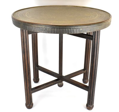 Lot 66 - A Benares-style table with circular brass...