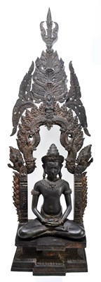 Lot 647 - A bronze figure representing a seated Guanyin on shrine