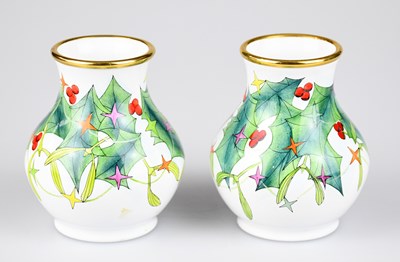 Lot 57 - MOORCROFT; a pair of baluster shaped vases...