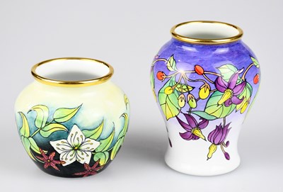 Lot 109 - MOORCROFT; two enamelled vases, including a...