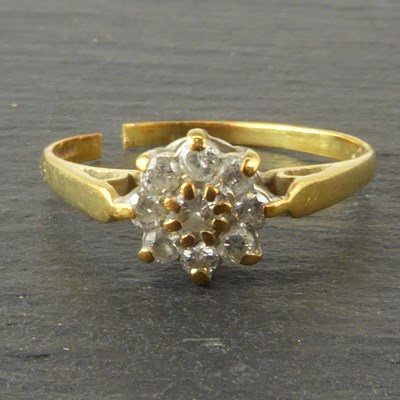 Lot 1112 - An 18ct gold diamond flower cluster ring with...