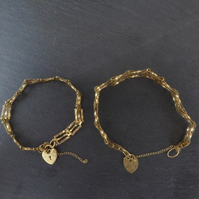 Lot 1167 - Two matching 9ct gold three bar gate bracelets,...