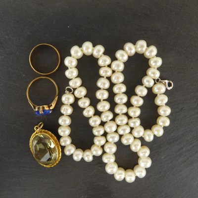 Lot 1301 - A 9ct gold band ring, size K and a 9ct gold...