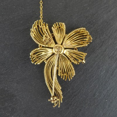 Lot 1201 - ZEETA; a 9ct gold floral brooch with central...