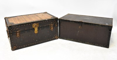 Lot 145 - A vintage metal trunk with leather carrying...