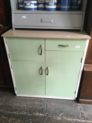 Lot 252 - A 1950s kitchen cabinet with formica top above...