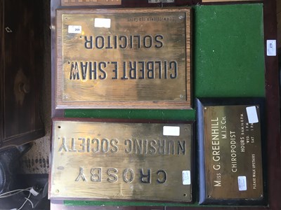 Lot 269 - Three brass advertising wall plates, including...