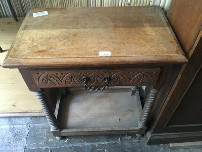 Lot 277 - An oak side table with carved drawer on turned...