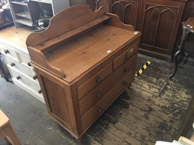 Lot 293 - An old pine wash stand with raised back above...