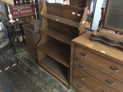 Lot 294 - ERCOL; a medium elm waterfall bookcase, width...