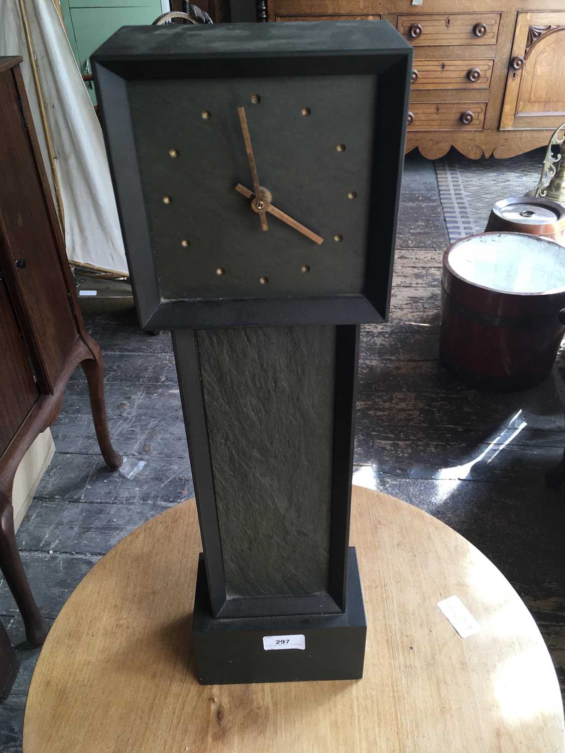 Lot 297 A slate mantel clock in the form of a