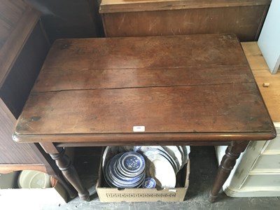 Lot 299 - A pitch pine side table on turned column...