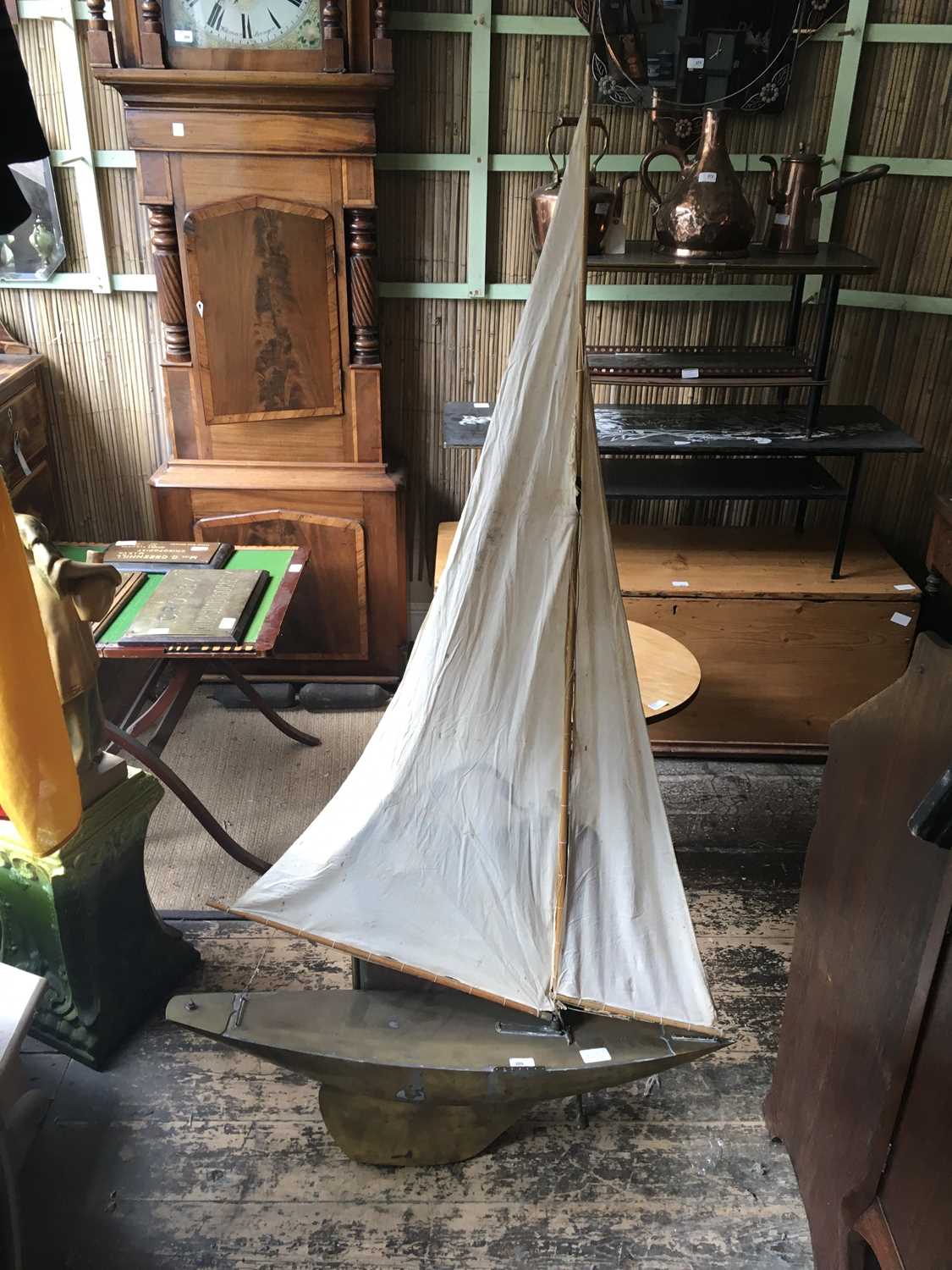 Lot 309 - A vintage model pond yacht, length 90cm.