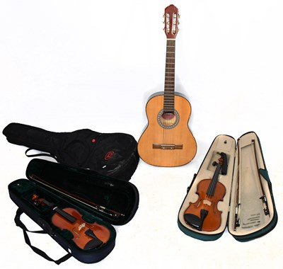 Lot 236 - Two modern cased violins and modern acoustic guitar (3).