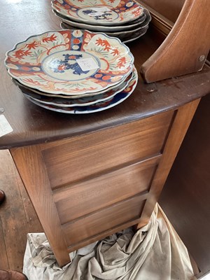 Lot 329 - ERCOL; a medium elm dresser with plate rack...