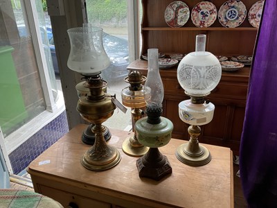 Lot 343 - Five Victorian oil lamps to include a brass...