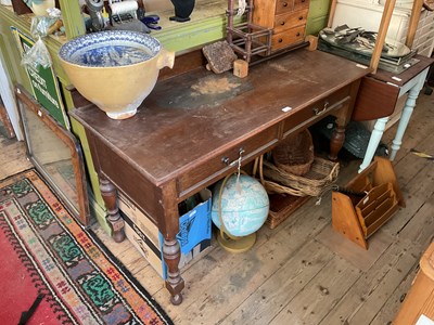 Lot 352 - An early 20th century oak writing table with...