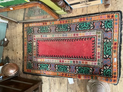 Lot 374 - A decorative rug with floral decoration in...