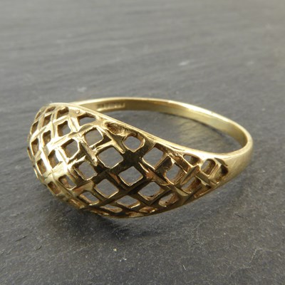 Lot 1126 - A 9ct gold dress ring with open basketweave...