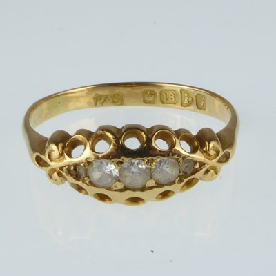 Lot 1115 - An 18ct gold ring, the pierced head set with...