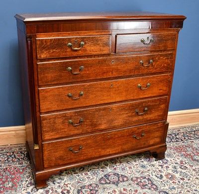 Lot 2436 - A late Georgian oak chest of two short over...