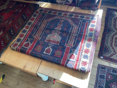 Lot 454 - An Afghan rug with stylised decoration of a...