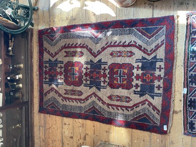 Lot 459 - An Afghan rug with stylised detail and crosses...