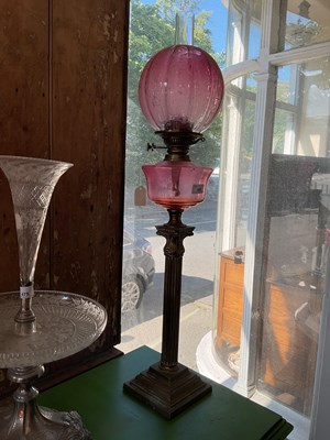 Lot 476 - A Victorian oil lamp with cranberry and clear...