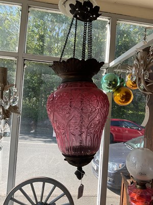 Lot 483 - A decorative cranberry glass hanging lantern...