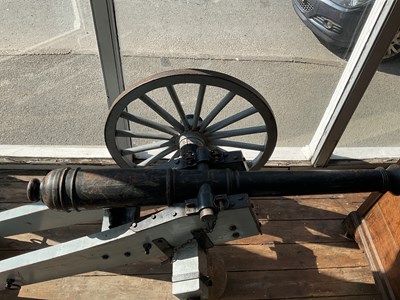 Lot 485 - A copy of a Napoleonic war cannon on a wooden...