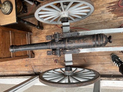 Lot 485 - A copy of a Napoleonic war cannon on a wooden...