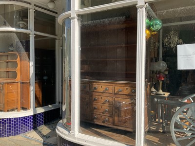 Lot 486 - An 18th century Welsh oak dresser, the boarded...