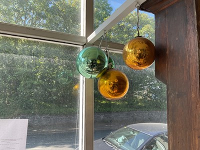 Lot 487 - Four decorative witches' balls.