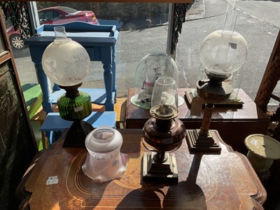 Lot 493 - Three early to mid 20th century oil lamps to...