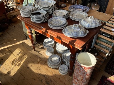 Lot 498 - A stained pine side table on turned column...