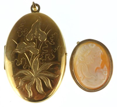 Lot 1232 - A modern 9ct gold double oval locket with...