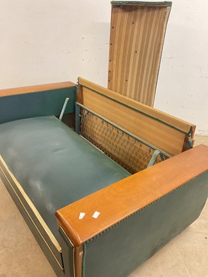 Lot 497 - An Art Deco French Moustache sofa bed with...