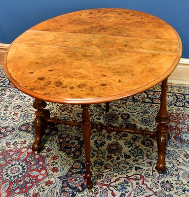 Lot 2434 - A Victorian burr walnut oval Sutherland table,...