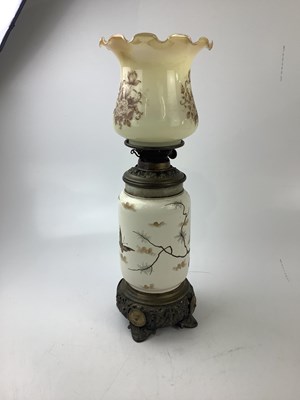 Lot 2348 - A decorative oil lamp decorated with...