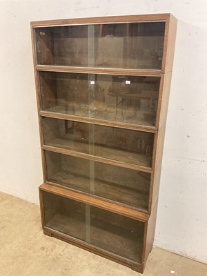 Lot 490 - Minty; a sectional library bookcase, with five...