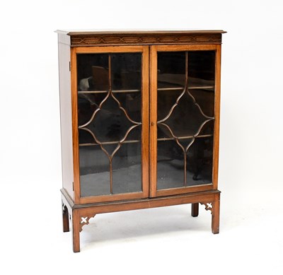 Lot 58 - A mid-20th century mahogany bookcase with...