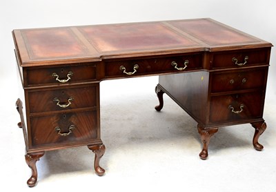 Lot 107 - A large mahogany reproduction pedestal desk...