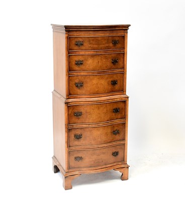 Lot 17 - A walnut veneered chest on chest of small...