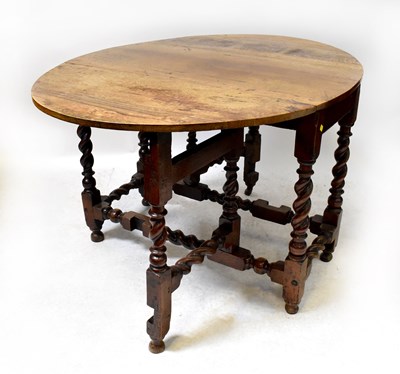 Lot 36 - An early 19th century gateleg oval table with...