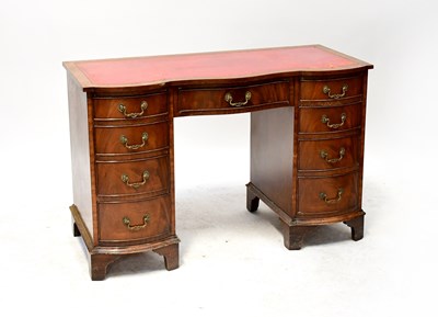 Lot 108 - A mahogany reproduction knee-hole desk with...