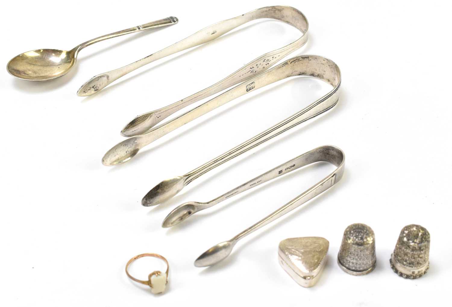 Lot 1113 - Three pairs of hallmarked silver sugar tongs
