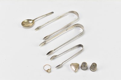 Lot 1113 - Three pairs of hallmarked silver sugar tongs