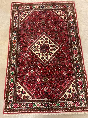 Lot 460 - A Hossenabad Persian rug, 98cm x 155cm.